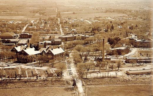 An aerial view of the Northwest campus from the north side in 1960, featuring the new gymnasium, Colden Hall, new residence halls and veterans' housing.